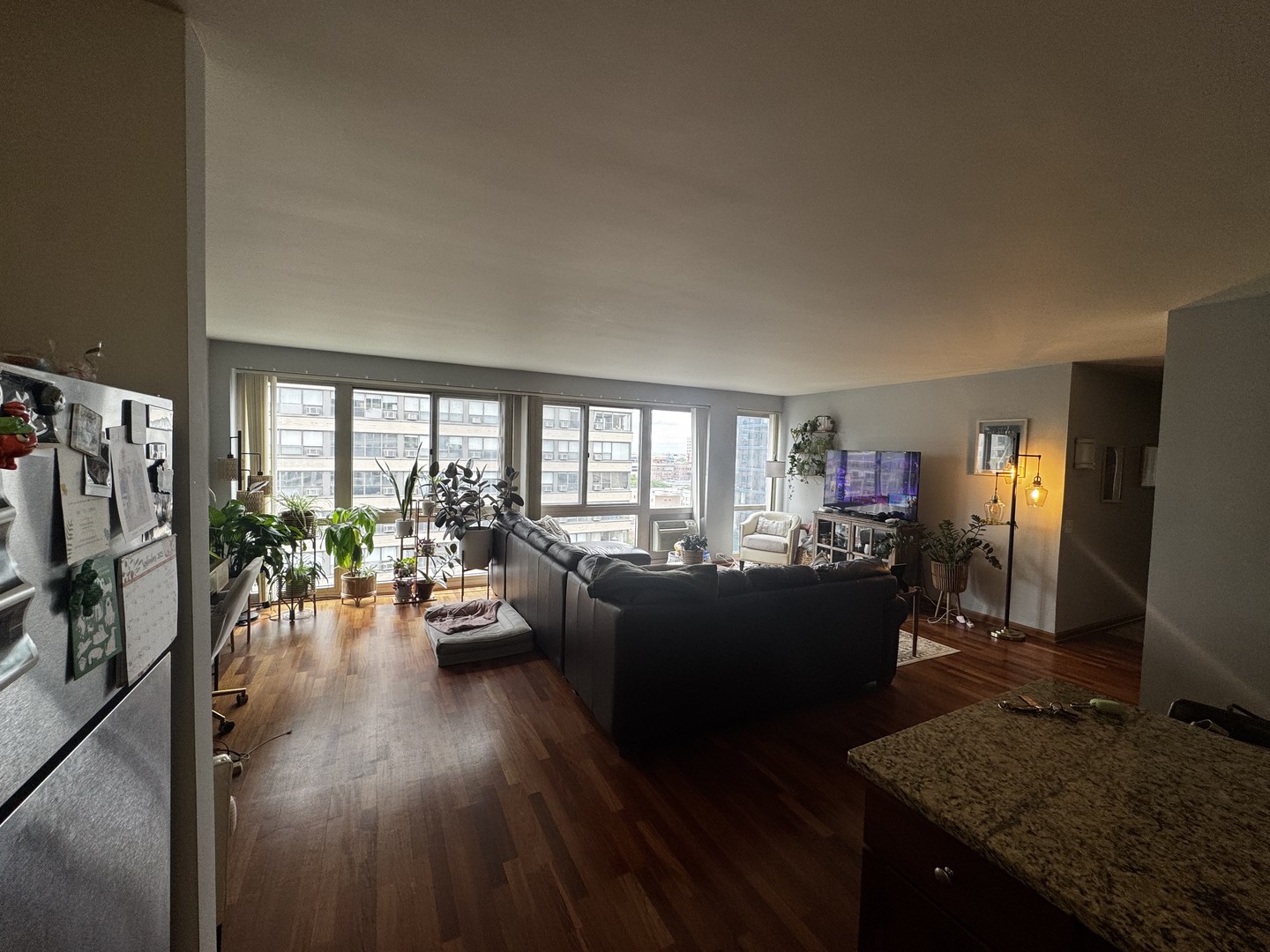 2933 North Sheridan Road, Unit 1201 Chicago, IL 60657 - Photo 3 of 16 a living room with furniture and a flat screen tv