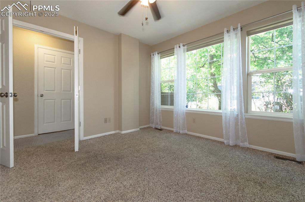 3216 Capstan Way Colorado Springs, CO 80906 - Photo 17 of 45 a view of an empty room with a window