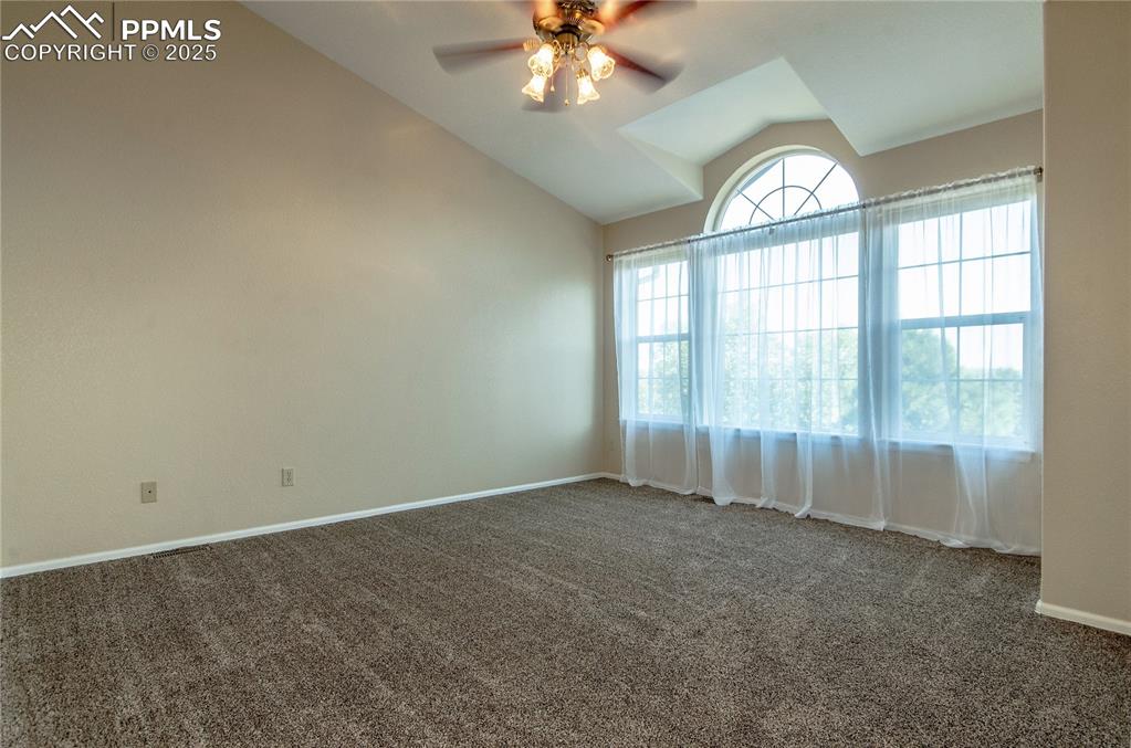 3216 Capstan Way Colorado Springs, CO 80906 - Photo 21 of 45 an empty room with chandelier fan and windows