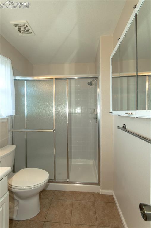 3216 Capstan Way Colorado Springs, CO 80906 - Photo 23 of 45 a bathroom with a toilet and a shower
