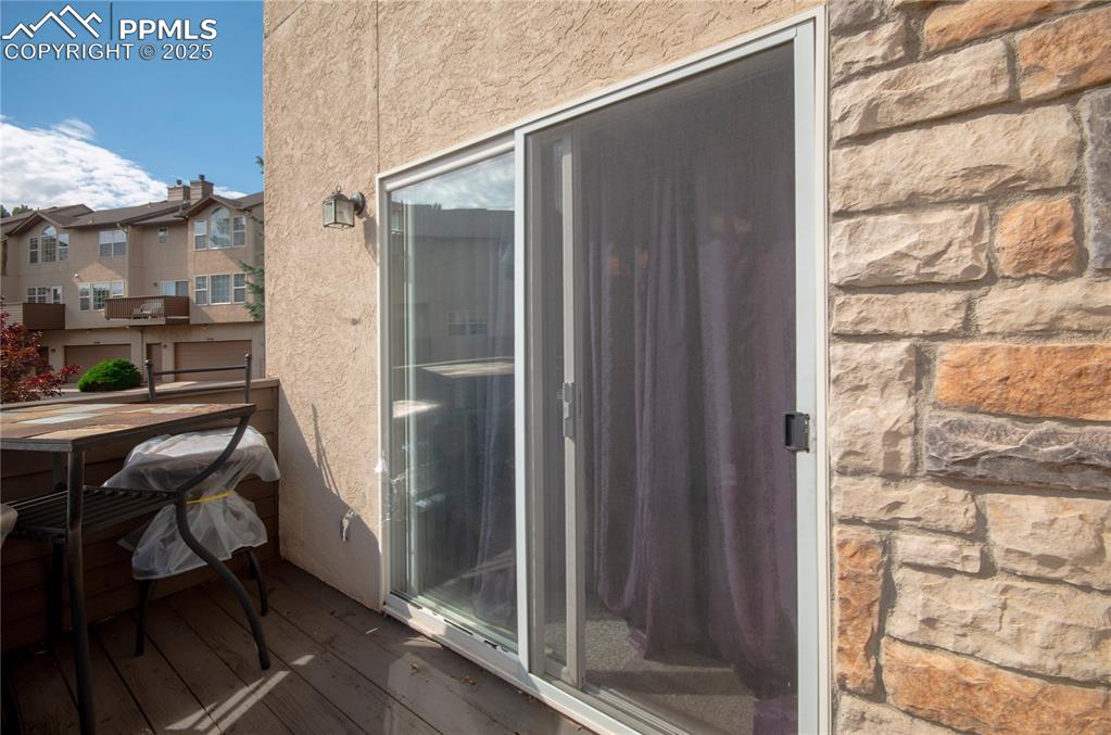 3216 Capstan Way Colorado Springs, CO 80906 - Photo 31 of 45 a balcony with table and chairs