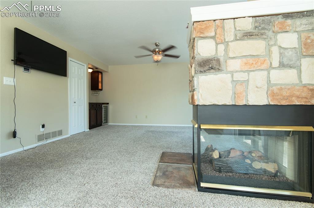 3216 Capstan Way Colorado Springs, CO 80906 - Photo 10 of 45 a view of a livingroom with a flat screen tv