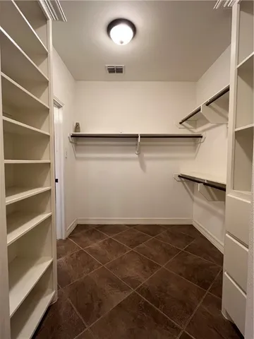 a bathroom with a sink vanity and a mirror