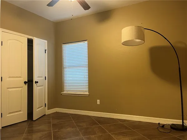 a view of a room with closet and windows