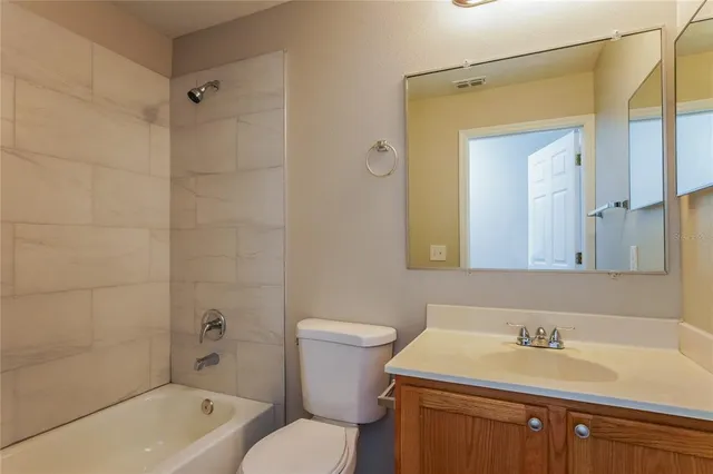 a bathroom with a sink a toilet and a bathtub