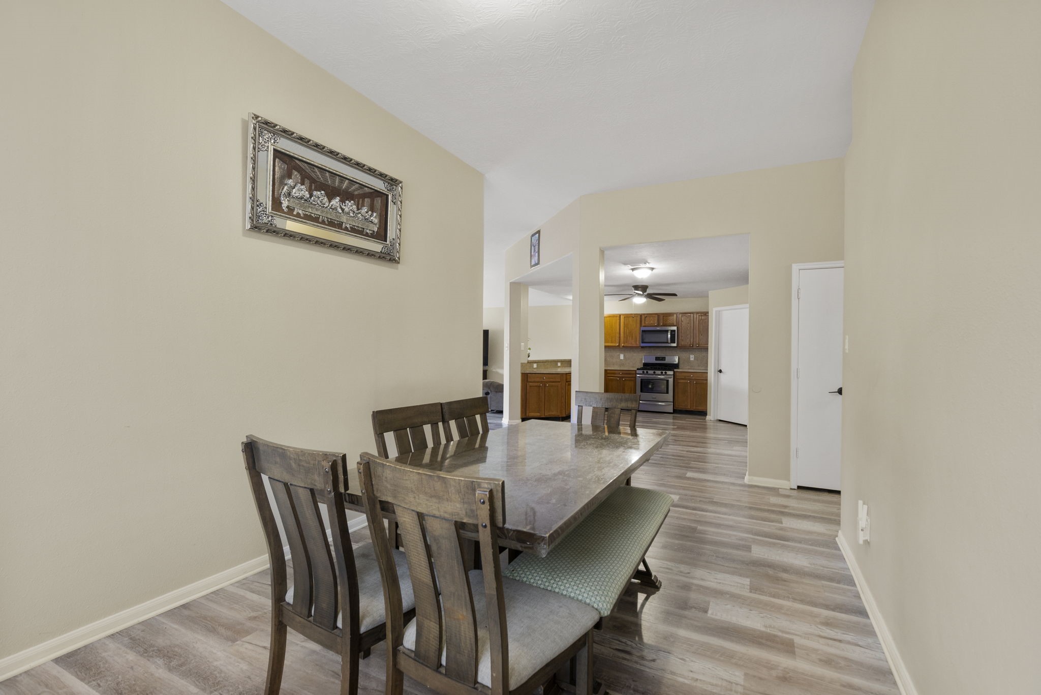 29106 Foxingham Circle Spring, TX 77386 - Photo 11 of 47 a dining room with furniture and wooden floor