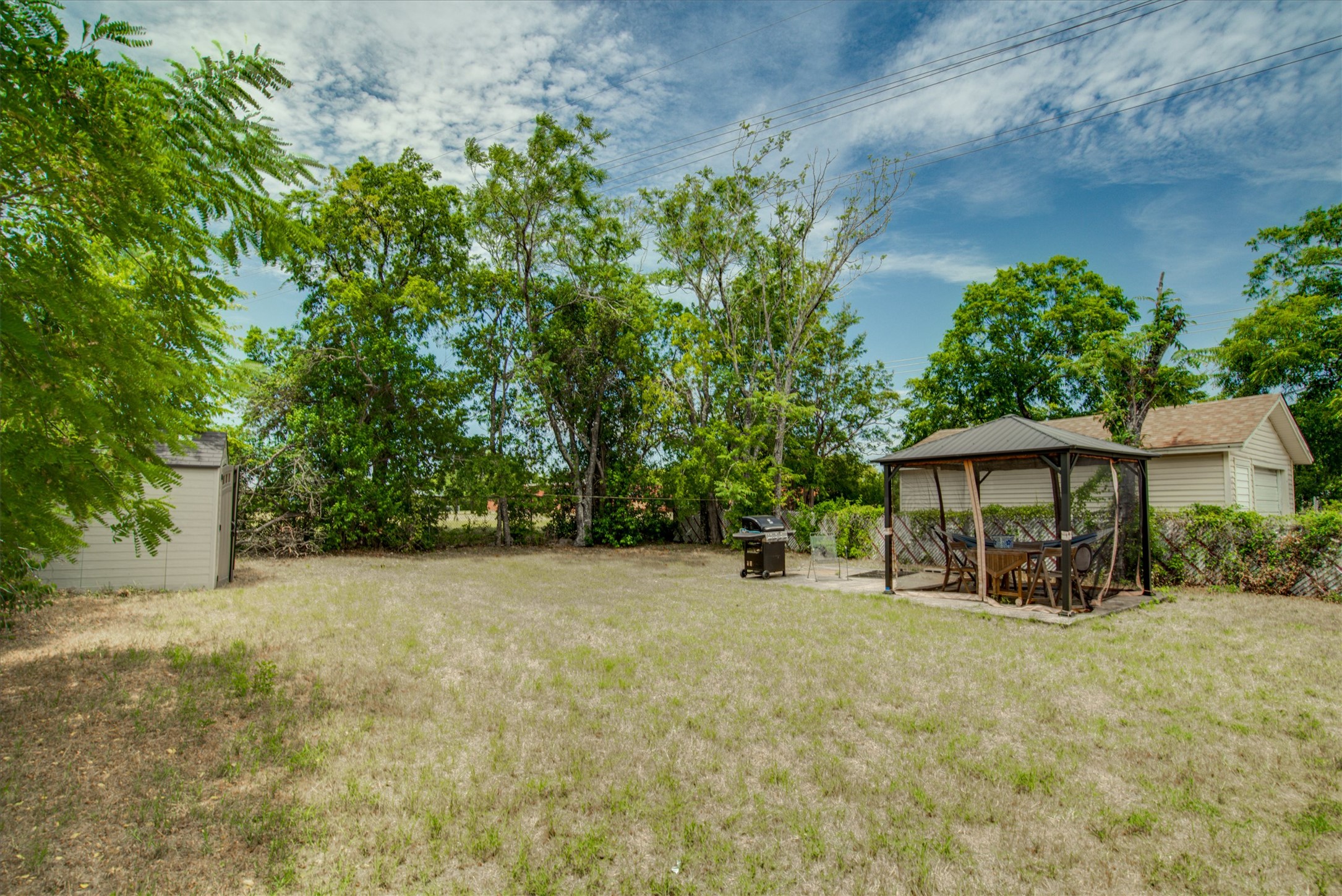 4615 Ribbecke Avenue Austin, TX 78721 - Photo 17 of 19 Fenced backyard featuring a gazebo, a patio area, and an outdoor structure
