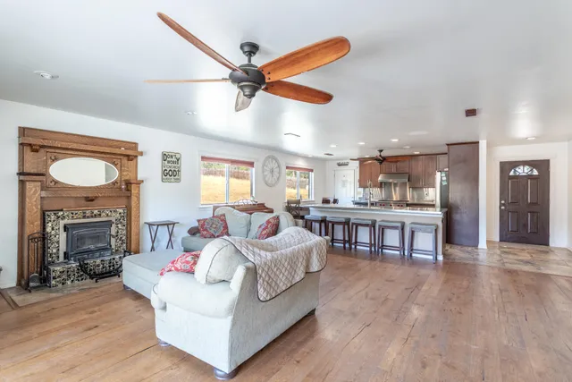 a bathroom with a double vanity sink toilet mirror and bathtub