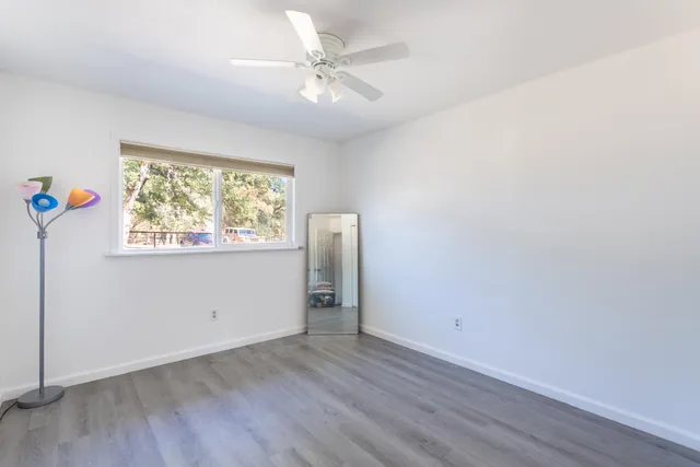 a bathroom with a shower curtain and a window