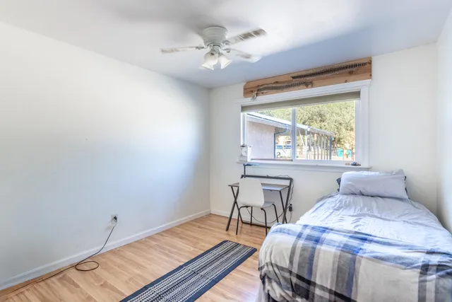 a view of a balcony with wooden floor