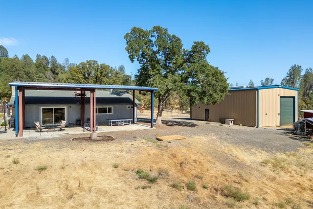 an aerial view of residential house with parking space