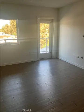 a kitchen with stainless steel appliances a refrigerator sink and cabinets