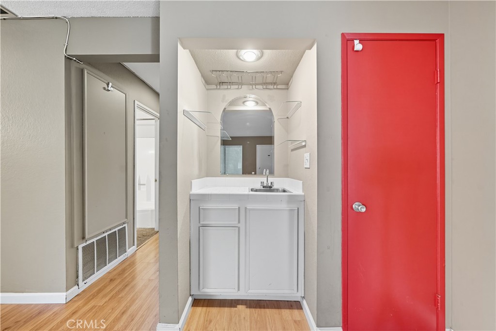 1000 Central Avenue, Unit 8 Riverside, CA 92507 - Photo 11 of 43 a bathroom with a sink a mirror and a vanity