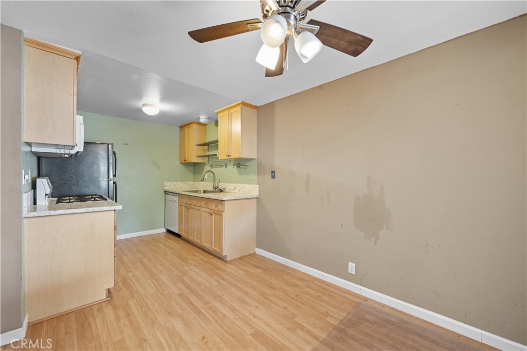 1000 Central Avenue, Unit 8 Riverside, CA 92507 - Photo 15 of 43 a kitchen with a sink cabinets and wooden floor