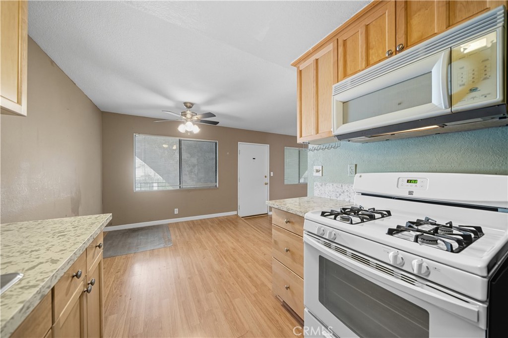 1000 Central Avenue, Unit 8 Riverside, CA 92507 - Photo 20 of 43 a kitchen with a stove and a microwave
