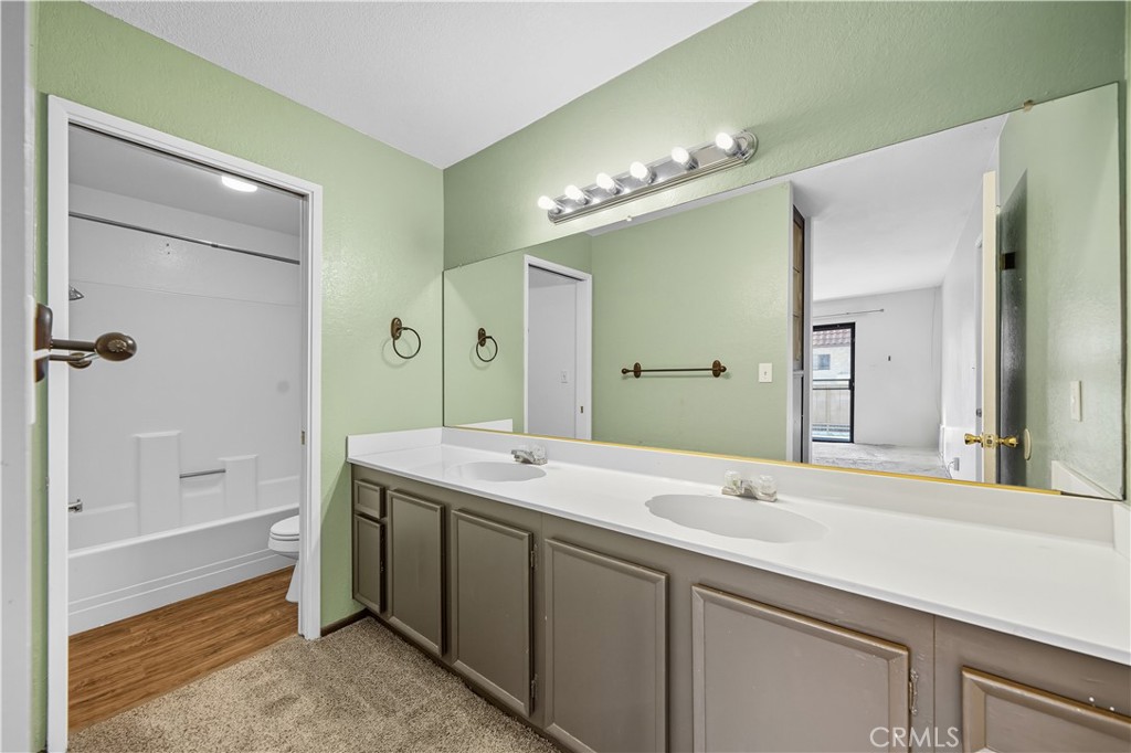 1000 Central Avenue, Unit 8 Riverside, CA 92507 - Photo 30 of 43 a spacious bathroom with a double vanity sink mirror and bathtub