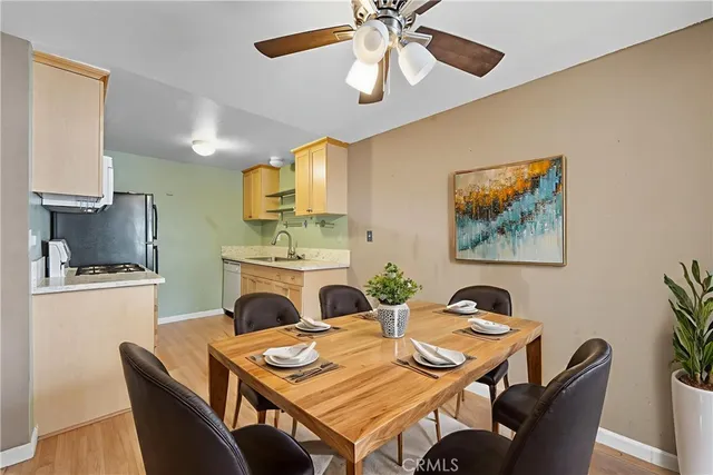 a view of a dining room with furniture and a chandelier