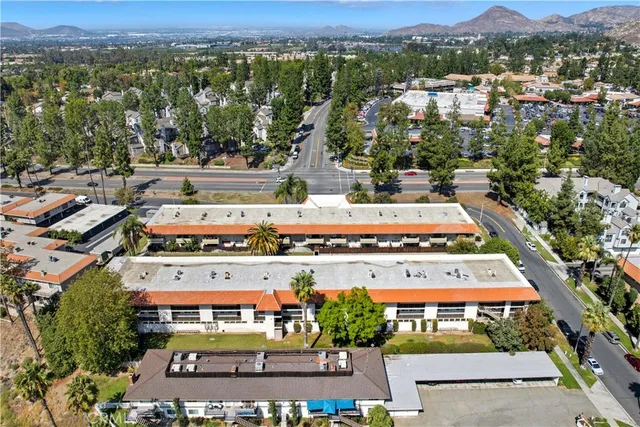 an aerial view of residential houses and outdoor space