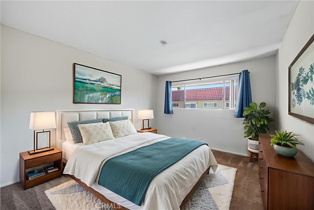 1000 Central Avenue, Unit 8 Riverside, CA 92507 - Photo 4 of 43 a bedroom with a bed and a potted plant