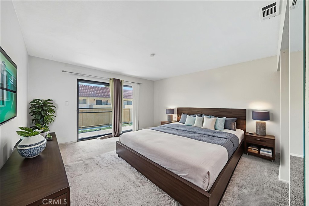 1000 Central Avenue, Unit 8 Riverside, CA 92507 - Photo 5 of 43 a bedroom with a bed and a couch