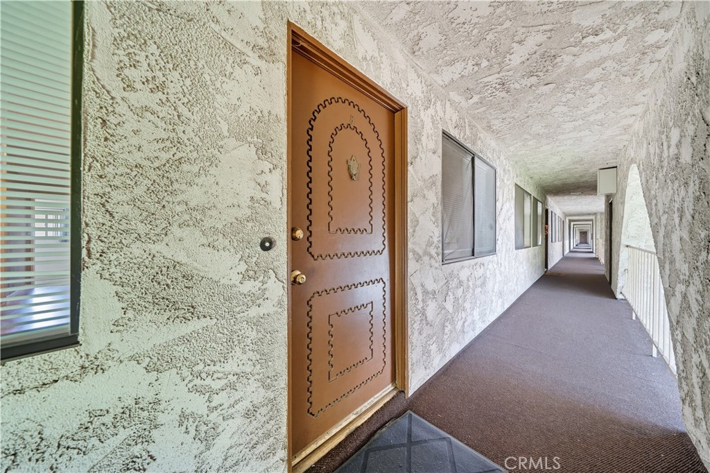 1000 Central Avenue, Unit 8 Riverside, CA 92507 - Photo 7 of 43 a view of a hallway with wooden floor and staircase