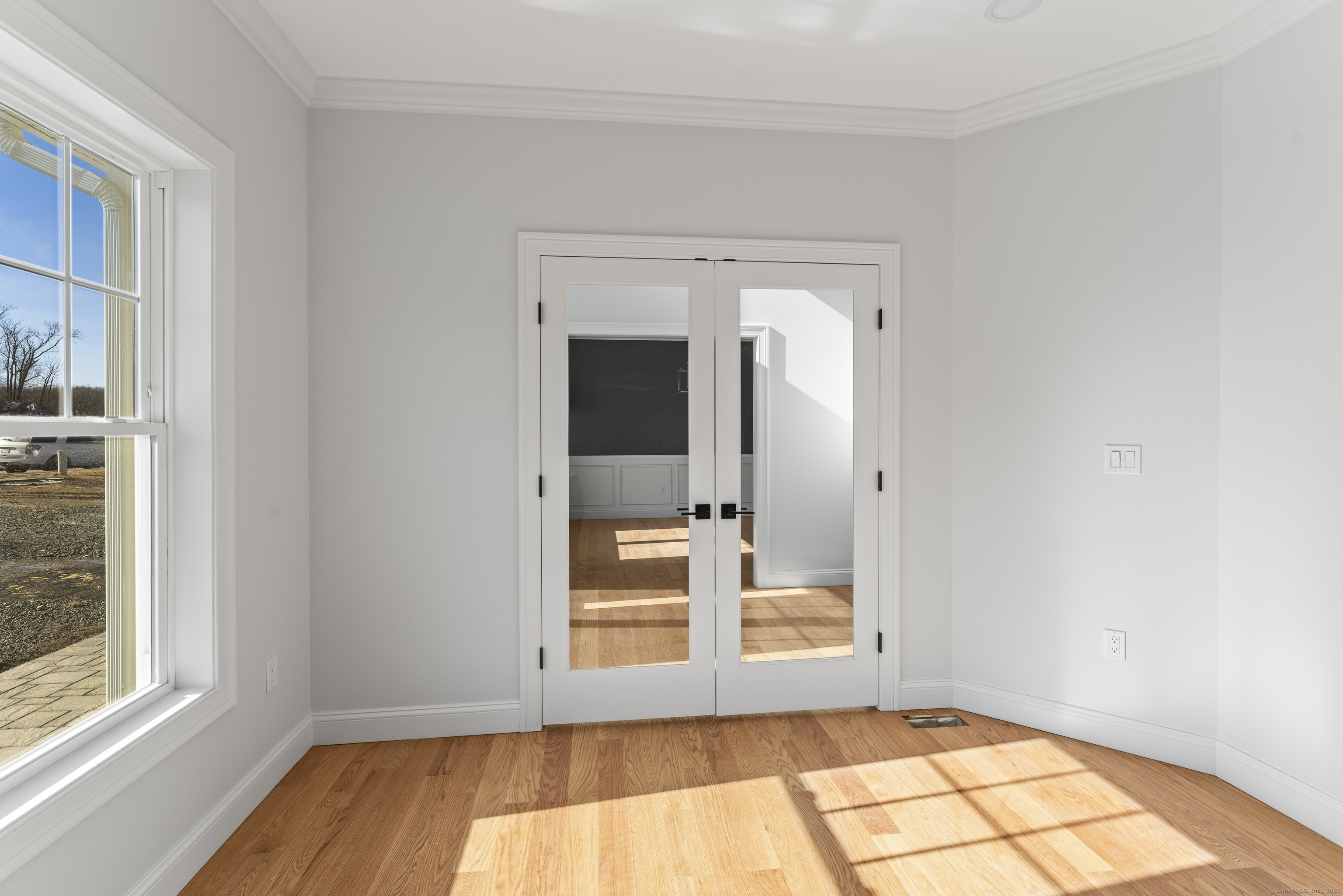 85 Rock Ridge Road Manchester, CT 06040 - Photo 21 of 27 a view of an empty room with a window