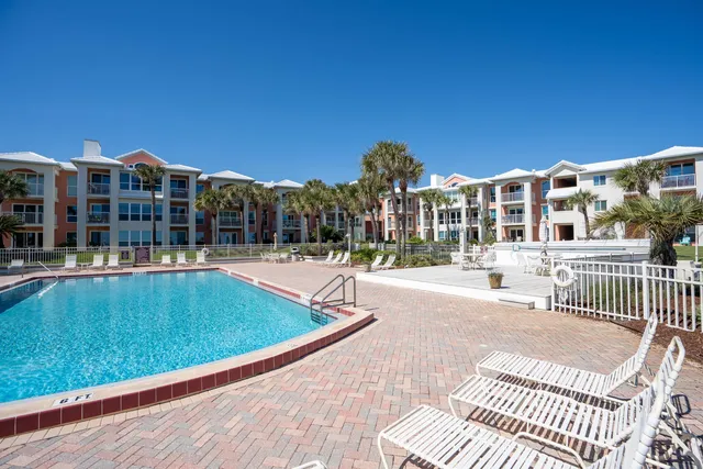 a view of a building with a yard