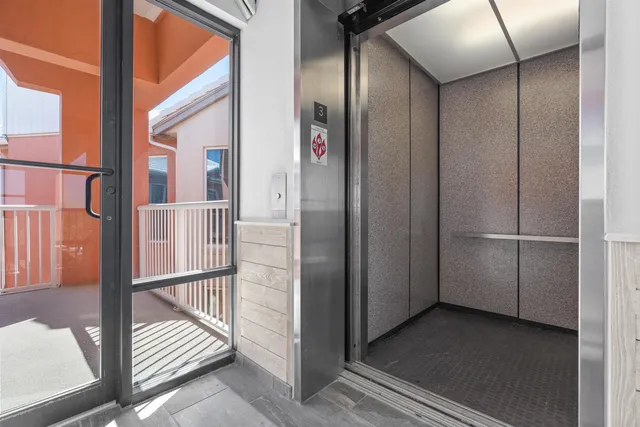 a swimming pool with outdoor seating