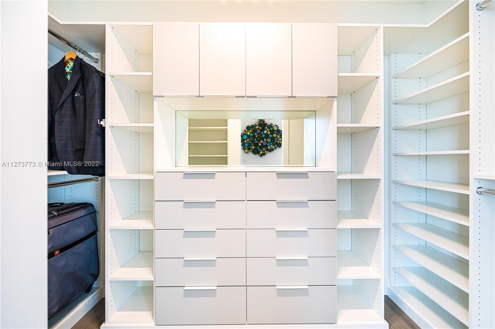 3000 Banyan Road, Unit B Boca Raton, FL 33432 - Photo 13 of 41 a view of walk in closet with empty racks