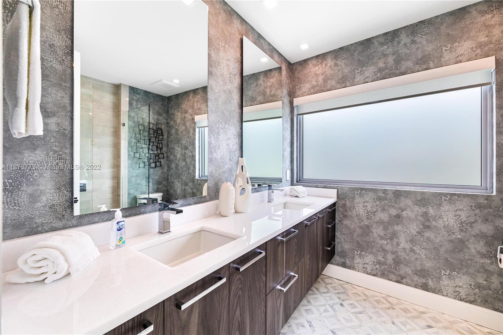 3000 Banyan Road, Unit B Boca Raton, FL 33432 - Photo 14 of 41 a bathroom with a double vanity sink and a mirror