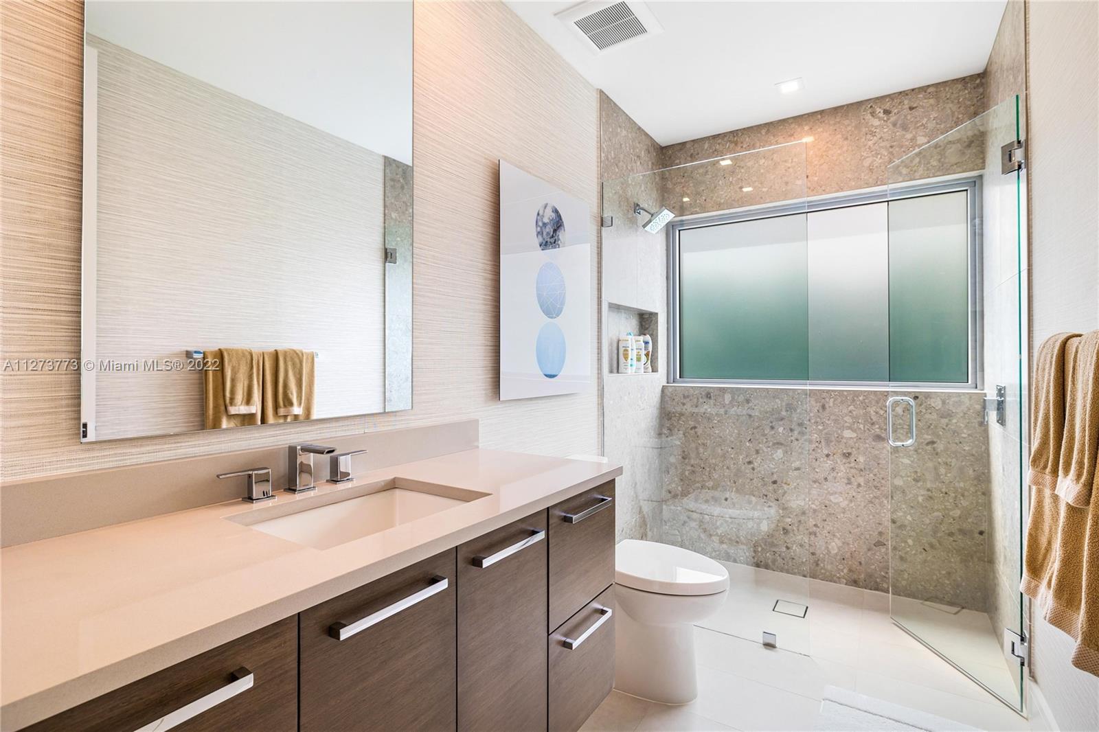 3000 Banyan Road, Unit B Boca Raton, FL 33432 - Photo 17 of 41 a bathroom with a granite countertop sink toilet and shower