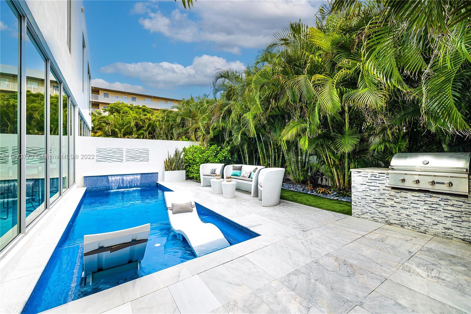 3000 Banyan Road, Unit B Boca Raton, FL 33432 - Photo 20 of 41 a view of a patio with swimming pool and furniture