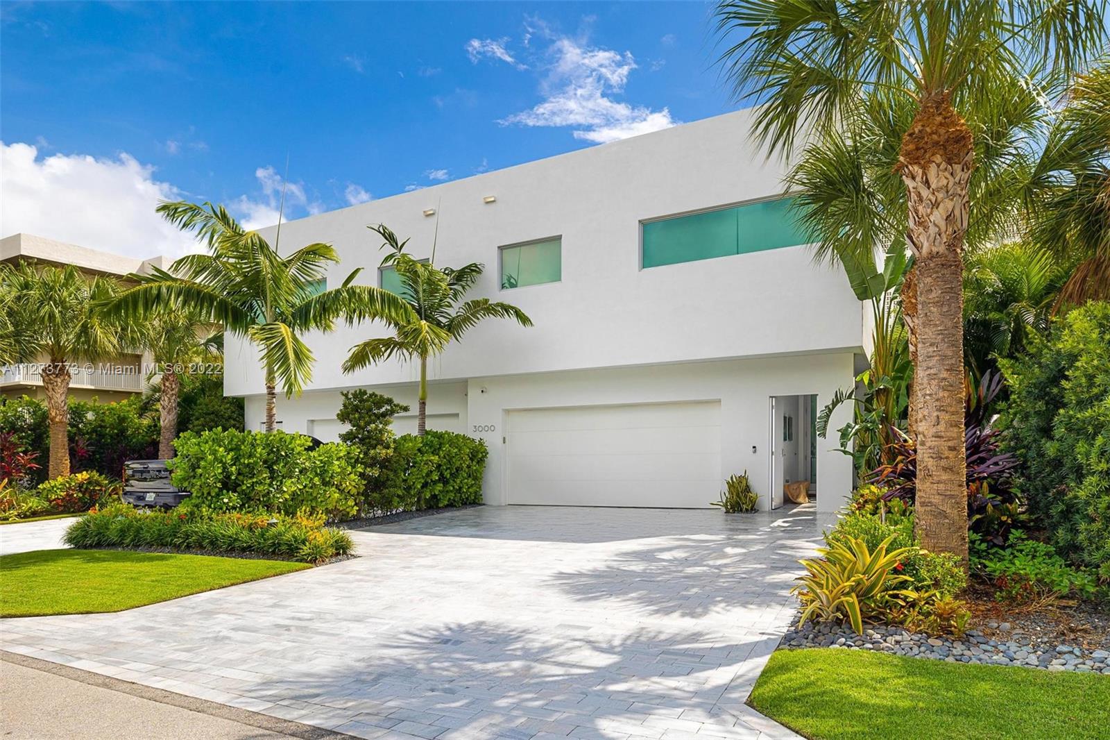3000 Banyan Road, Unit B Boca Raton, FL 33432 - Photo 26 of 41 a view of a house with a yard and potted plants