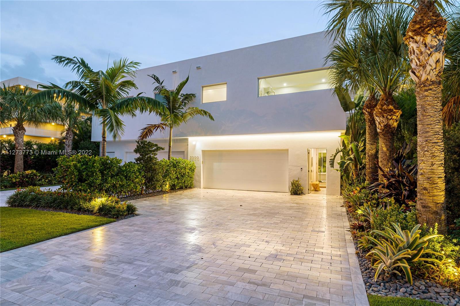 3000 Banyan Road, Unit B Boca Raton, FL 33432 - Photo 29 of 41 a front view of a house with a yard and a garage