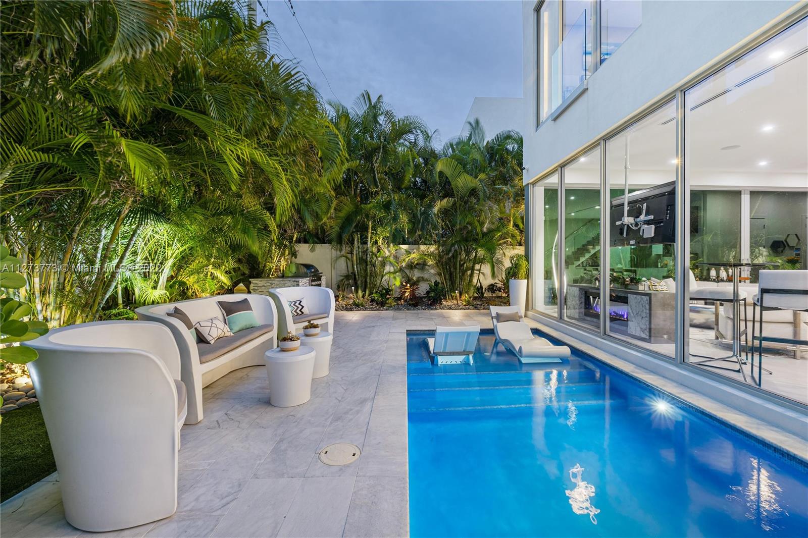 3000 Banyan Road, Unit B Boca Raton, FL 33432 - Photo 30 of 41 a view of swimming pool with outdoor seating and plants