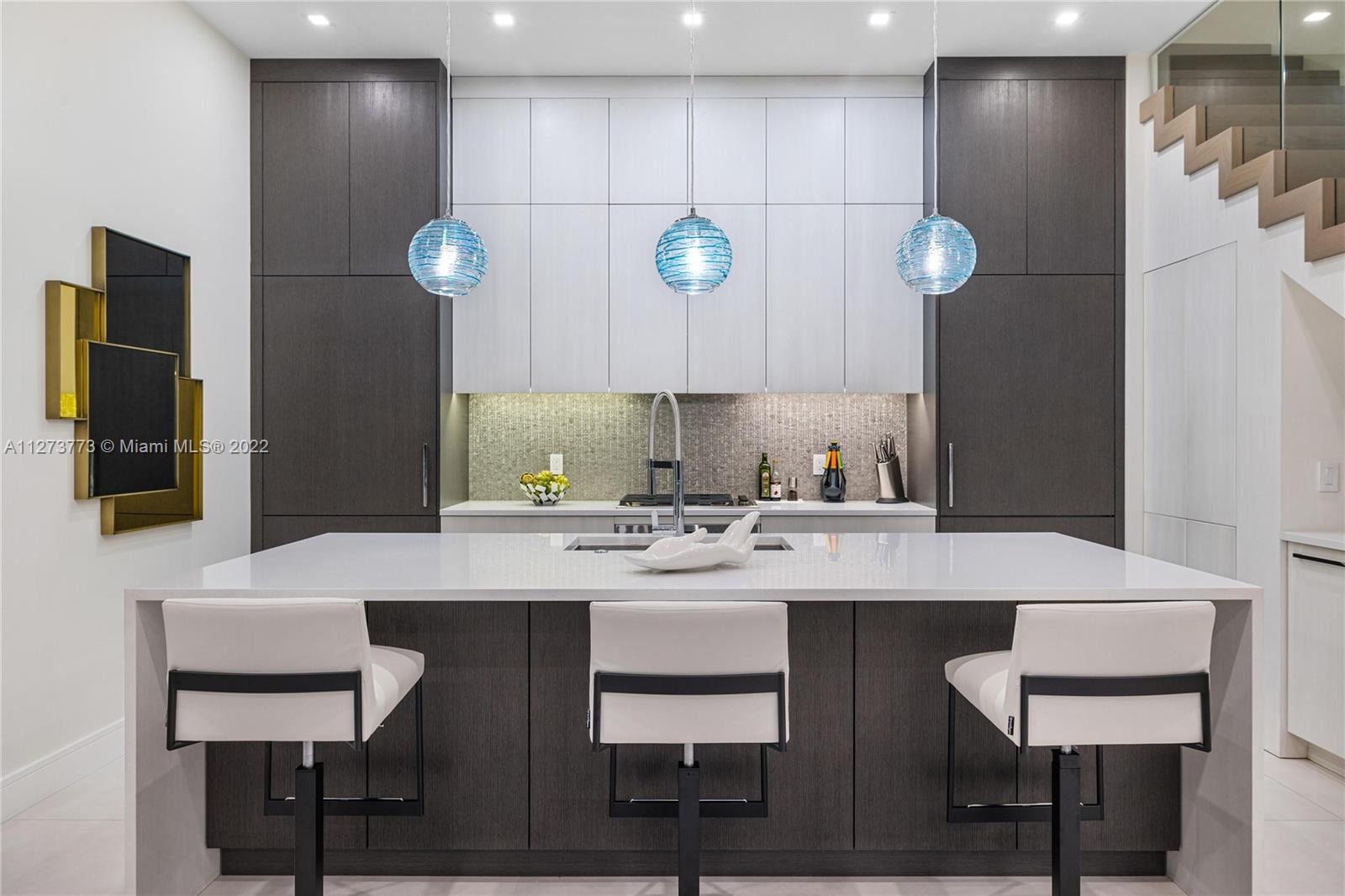 3000 Banyan Road, Unit B Boca Raton, FL 33432 - Photo 36 of 41 a kitchen with a sink cabinets and wooden floor