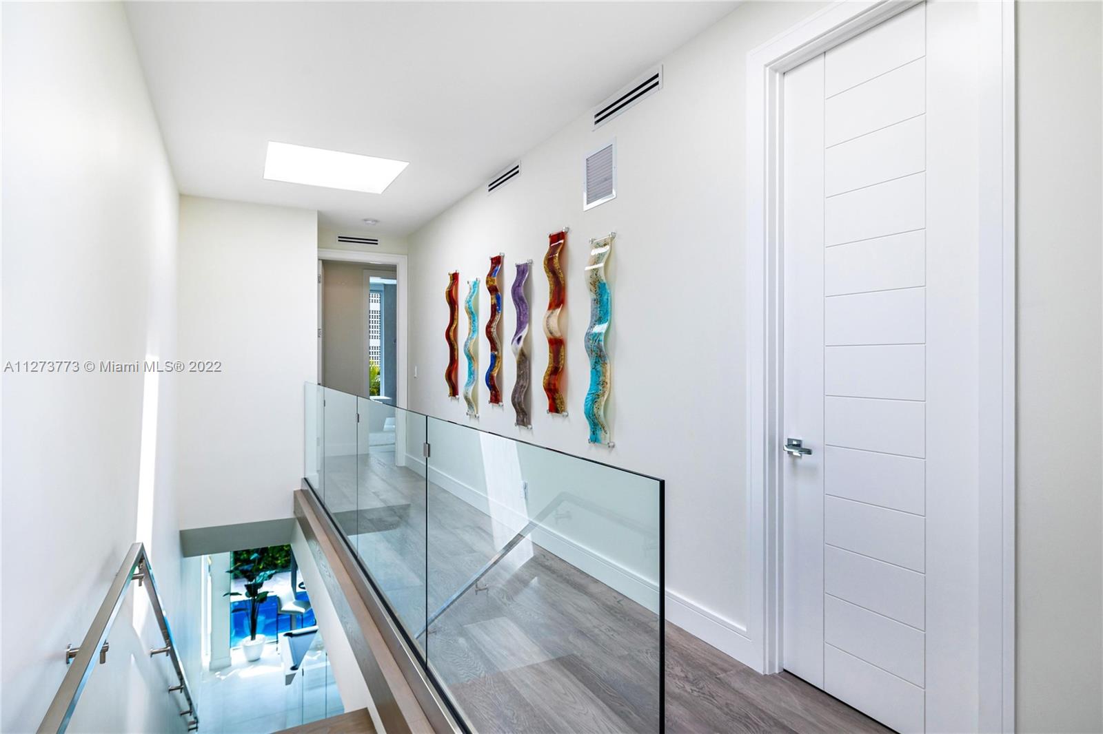 3000 Banyan Road, Unit B Boca Raton, FL 33432 - Photo 5 of 41 a view of a hallway with wooden floor and stairs