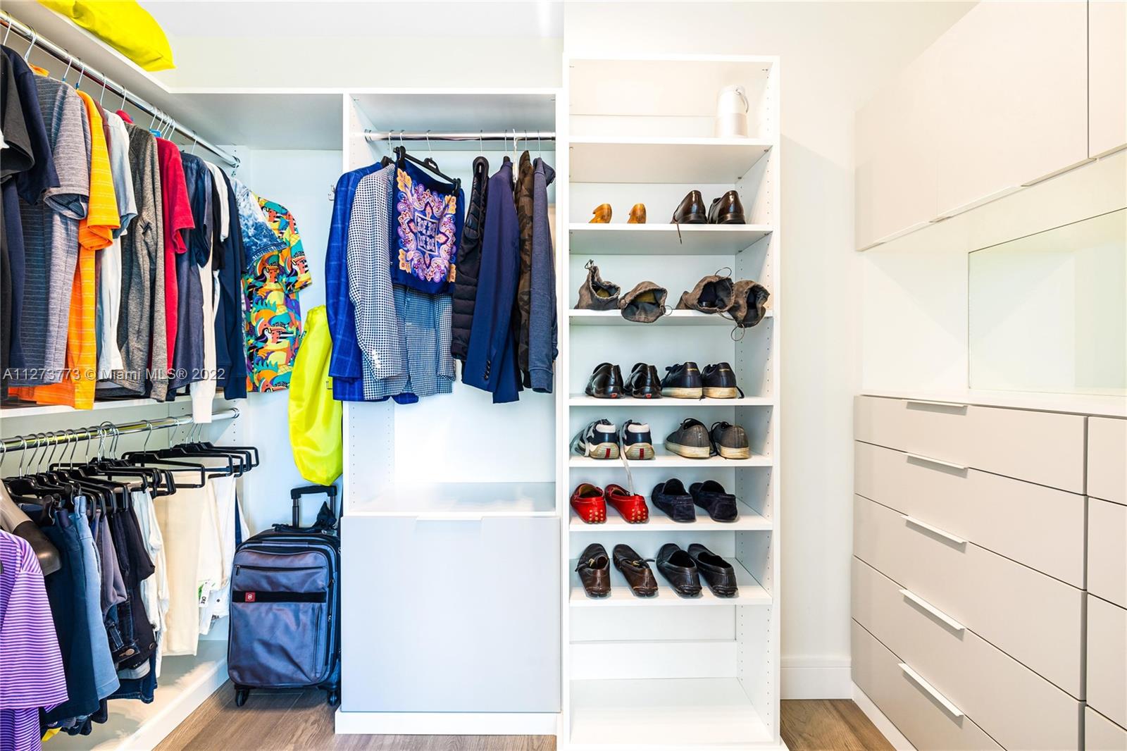 3000 Banyan Road, Unit B Boca Raton, FL 33432 - Photo 8 of 41 a view of walk in closet with clothes and shoes