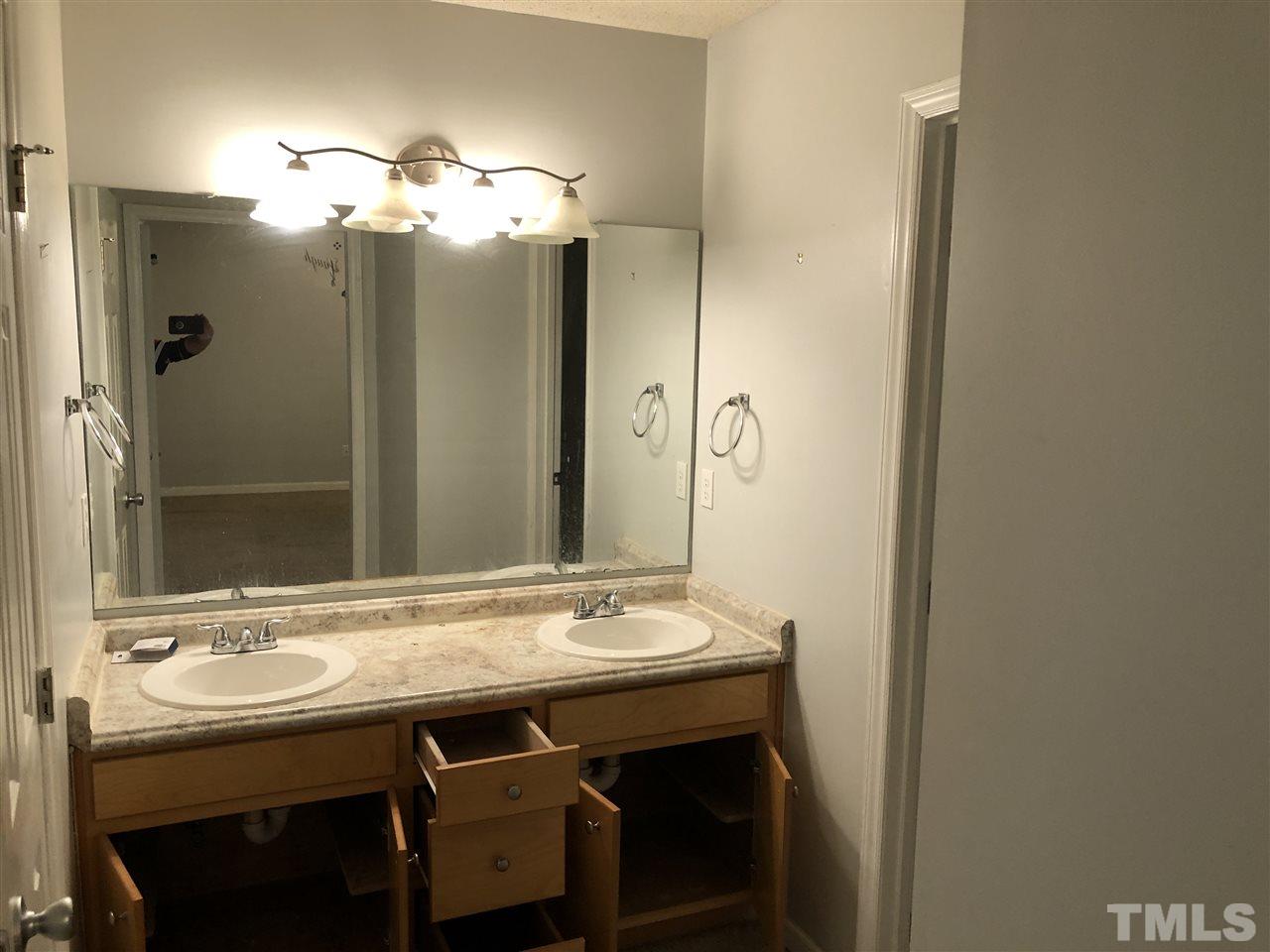 587 Rock Pillar Road Clayton, NC 27520 - Photo 12 of 12 a bathroom with a sink and a mirror