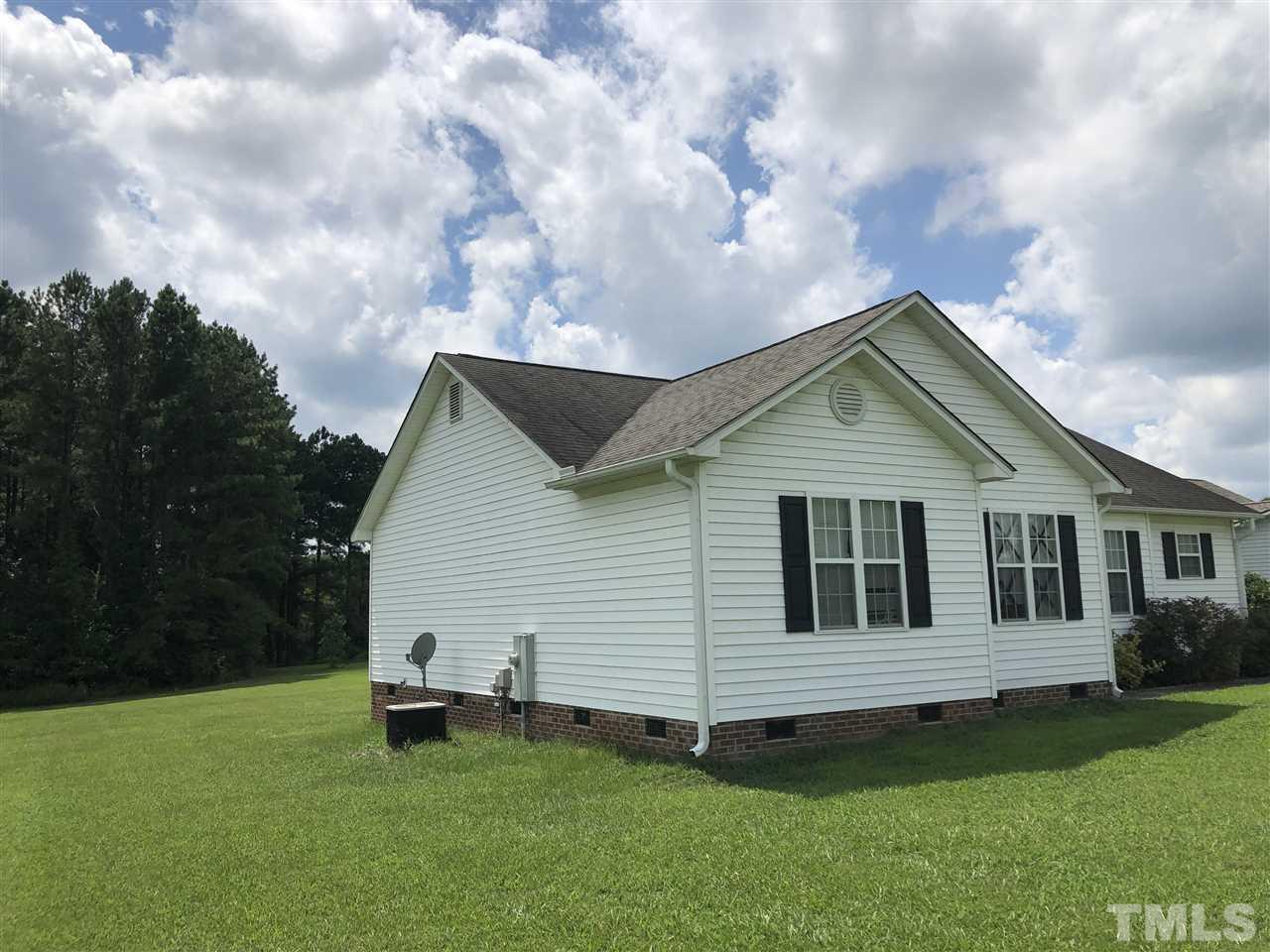 587 Rock Pillar Road Clayton, NC 27520 - Photo 3 of 12 a view of a house with a yard