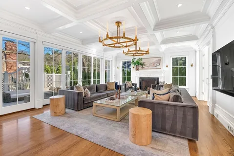 a living room with fireplace furniture and a flat screen tv