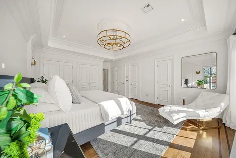 a bedroom with bed and a couch