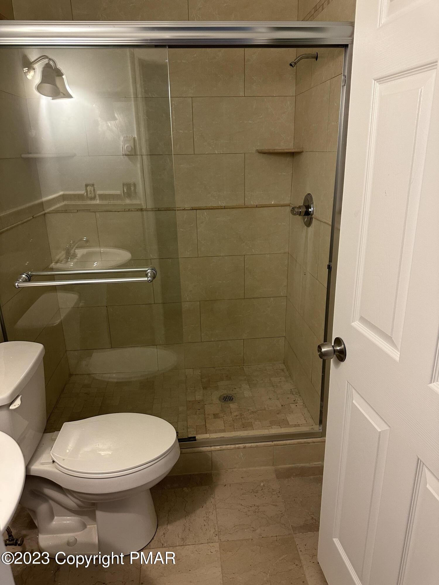 4215 Pine Ridge Drive East Bushkill, PA 18324 - Photo 12 of 18 a bathroom with a toilet and a shower