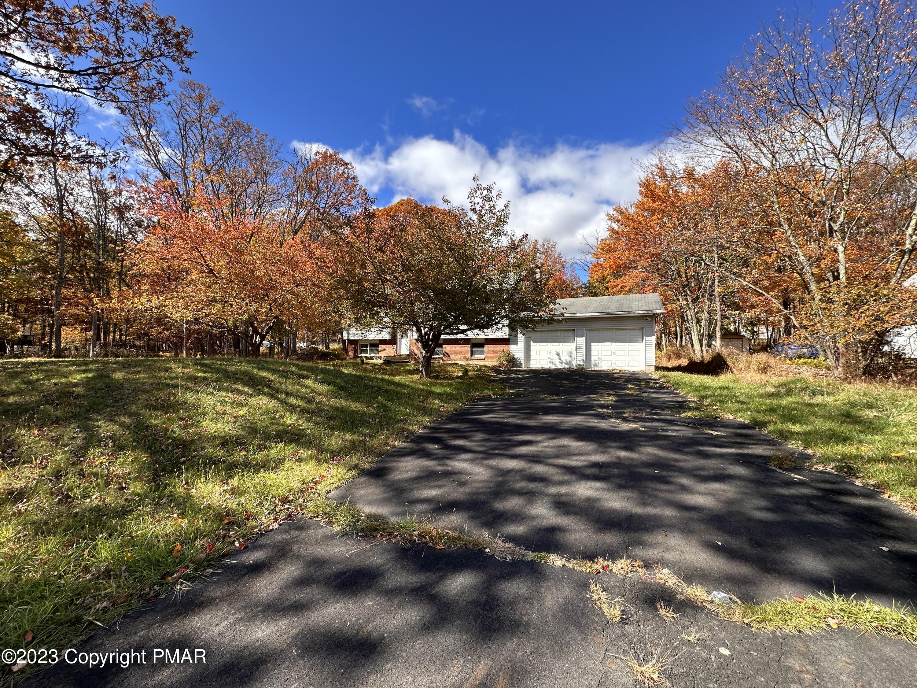 4215 Pine Ridge Drive East Bushkill, PA 18324 - Photo 17 of 18 a view of a house with a yard