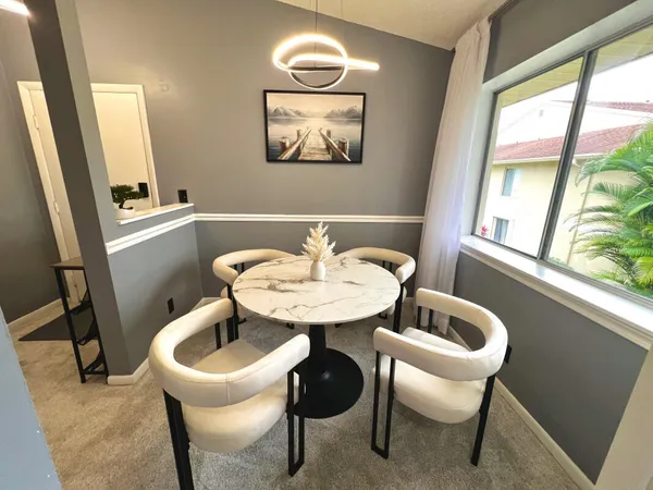 a kitchen with a sink a stove a refrigerator and cabinets