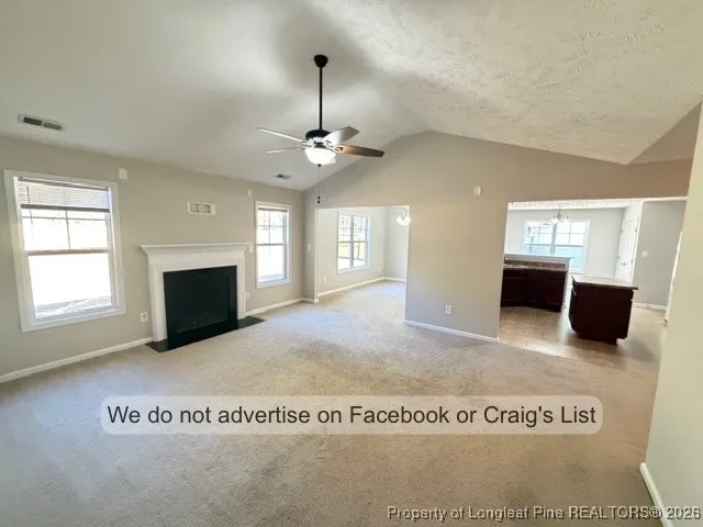 a view of livingroom with fireplace and window