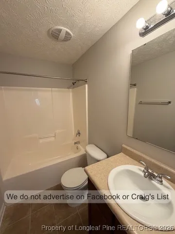 a bathroom with a sink and toilet