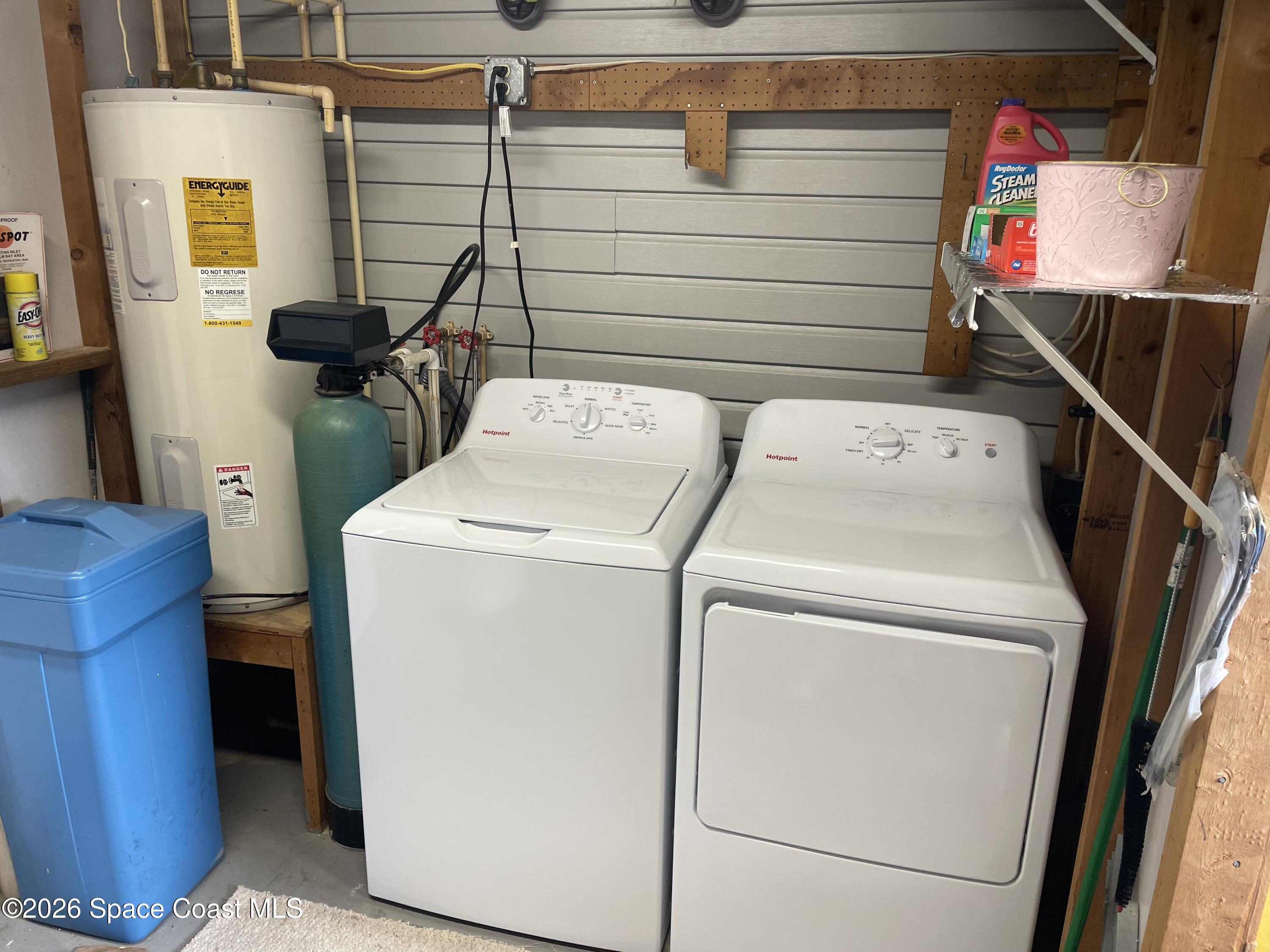 7579 Boxelder Road Micco, FL 32976 - Photo 24 of 30 a utility room with dryer and washer