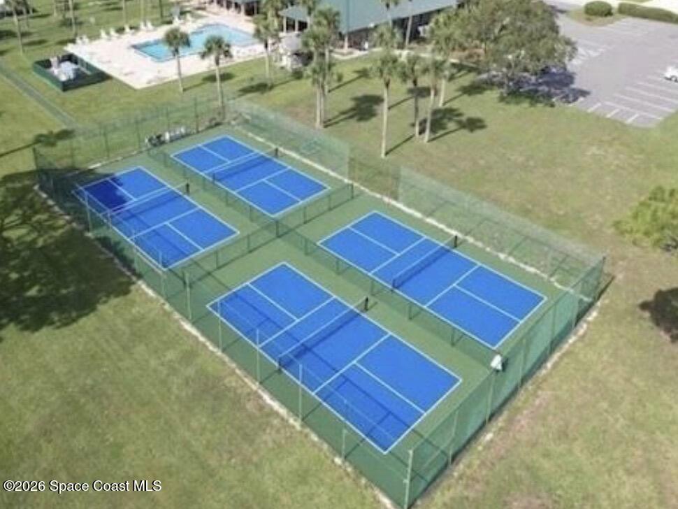 7579 Boxelder Road Micco, FL 32976 - Photo 29 of 30 a view of a tennis ground with large trees