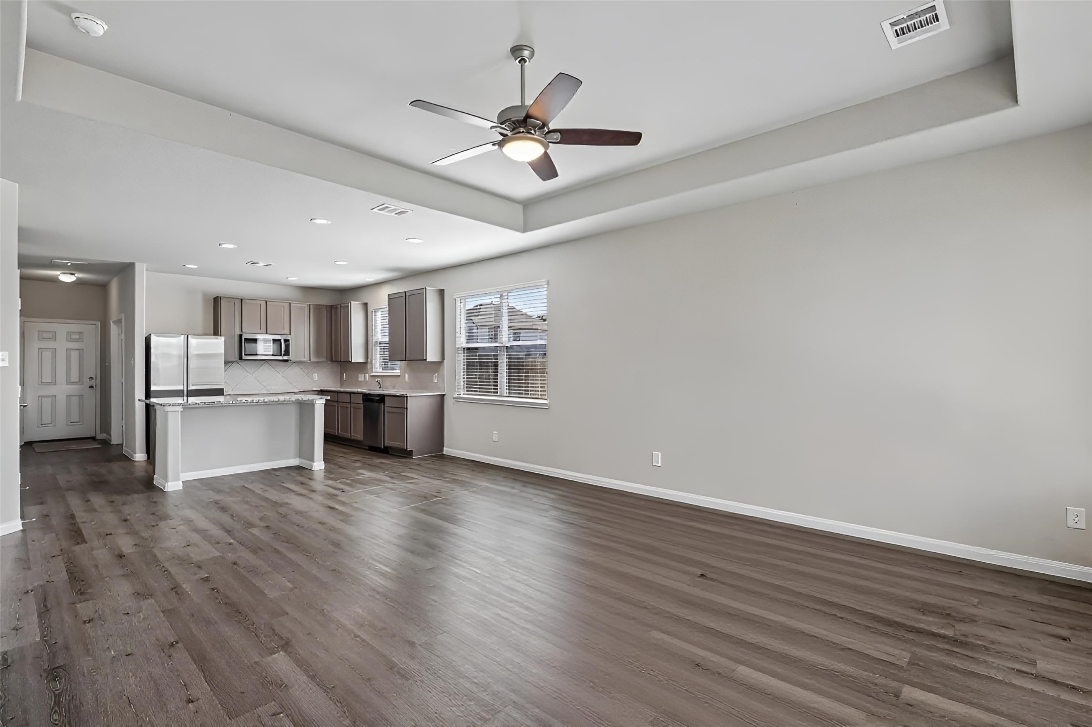 2903 August Mist Court Conroe, TX 77304 - Photo 9 of 40 Living area/kitchen